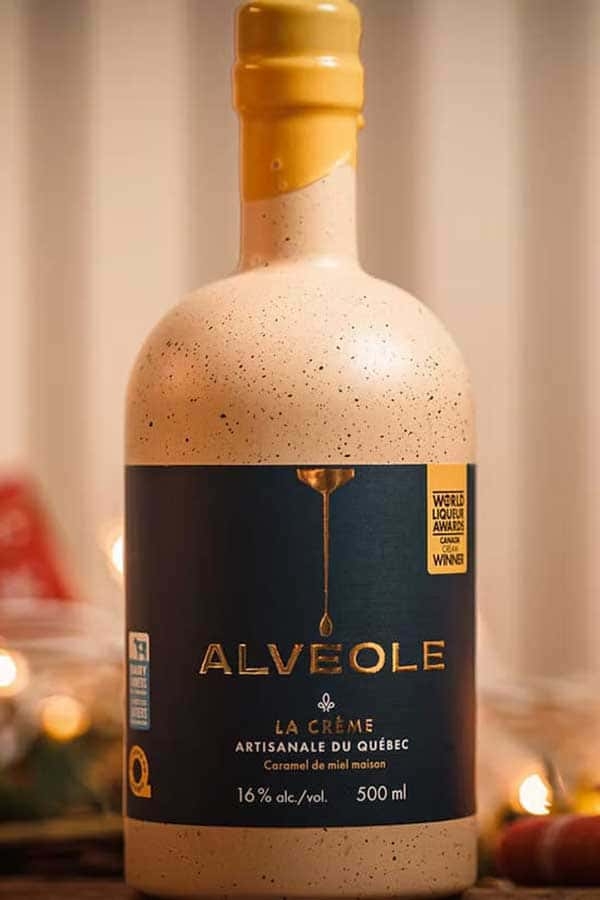 A bottle of Alvéole - La Crème liqueur from Miellerie King.