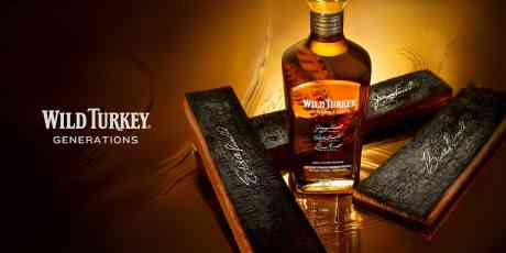 A bottle of Wild Turkey Generations whiskey with signed barrell staves.