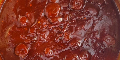 Pot of simmering Bourbon BBQ Sauce.