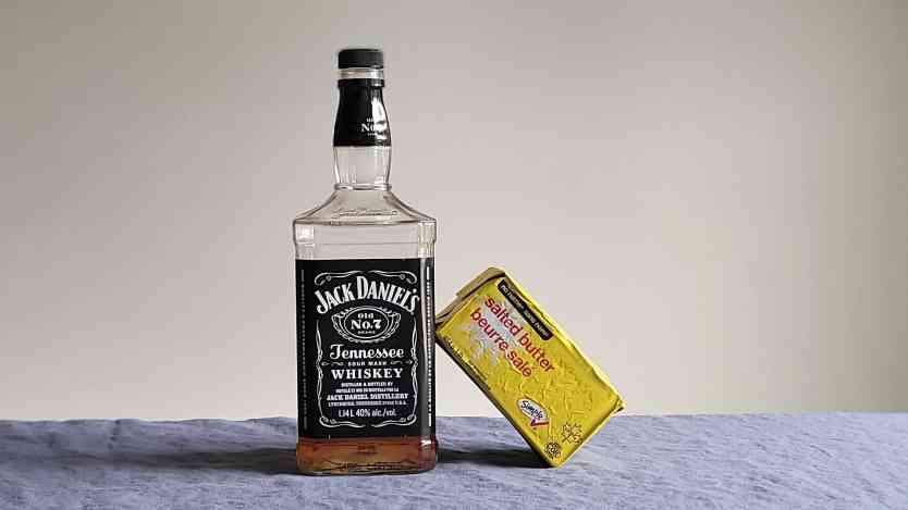 Bottle of Jack Daniel's Tennessee whiskey with butter.