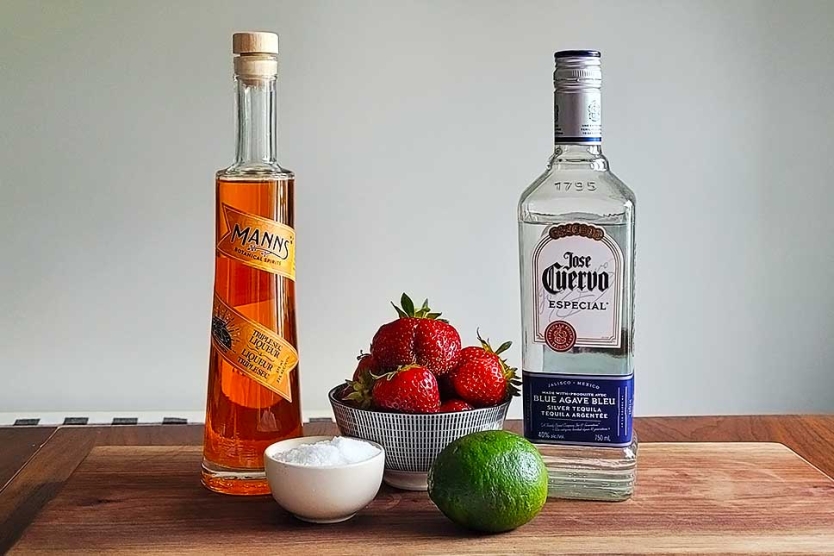 Tequila, Triple Sec, strawberries, and lime juice to make a Frozen Strawberry Margarita.