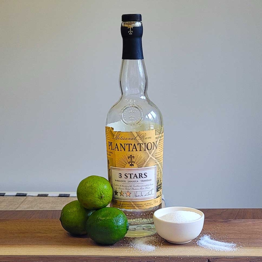 Classic daiquiri ingredients - rum, lime juice, and white sugar.